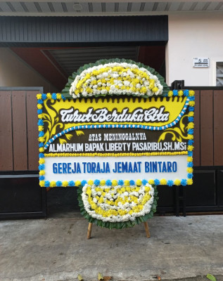 Papan Bunga Duka di Bane